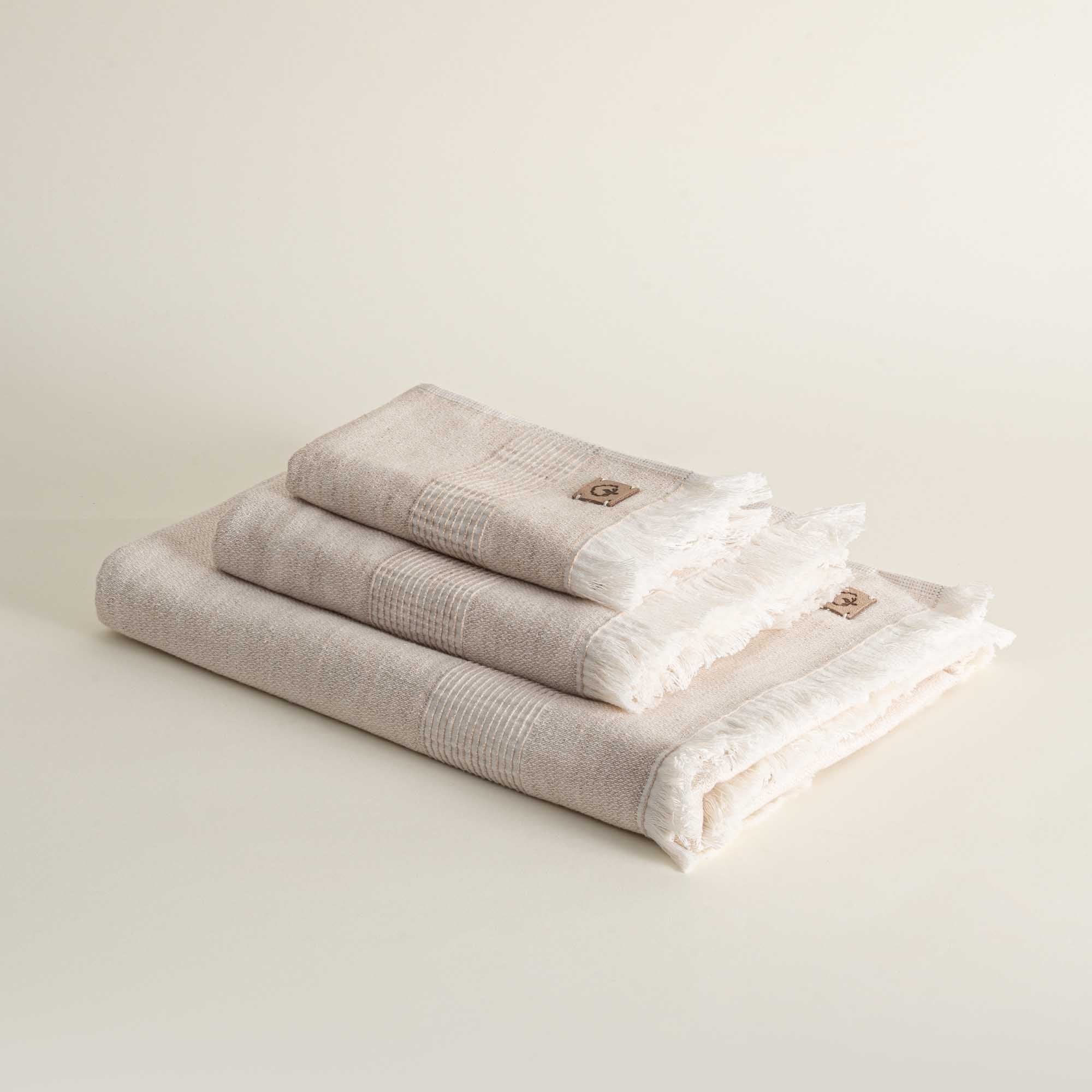 Minoa Hasna Organic Aegean Cotton and Linen Bath Set in Sandy Whisper colour, highlighting its luxurious blend of organic cotton and linen, designed for sustainable luxury
