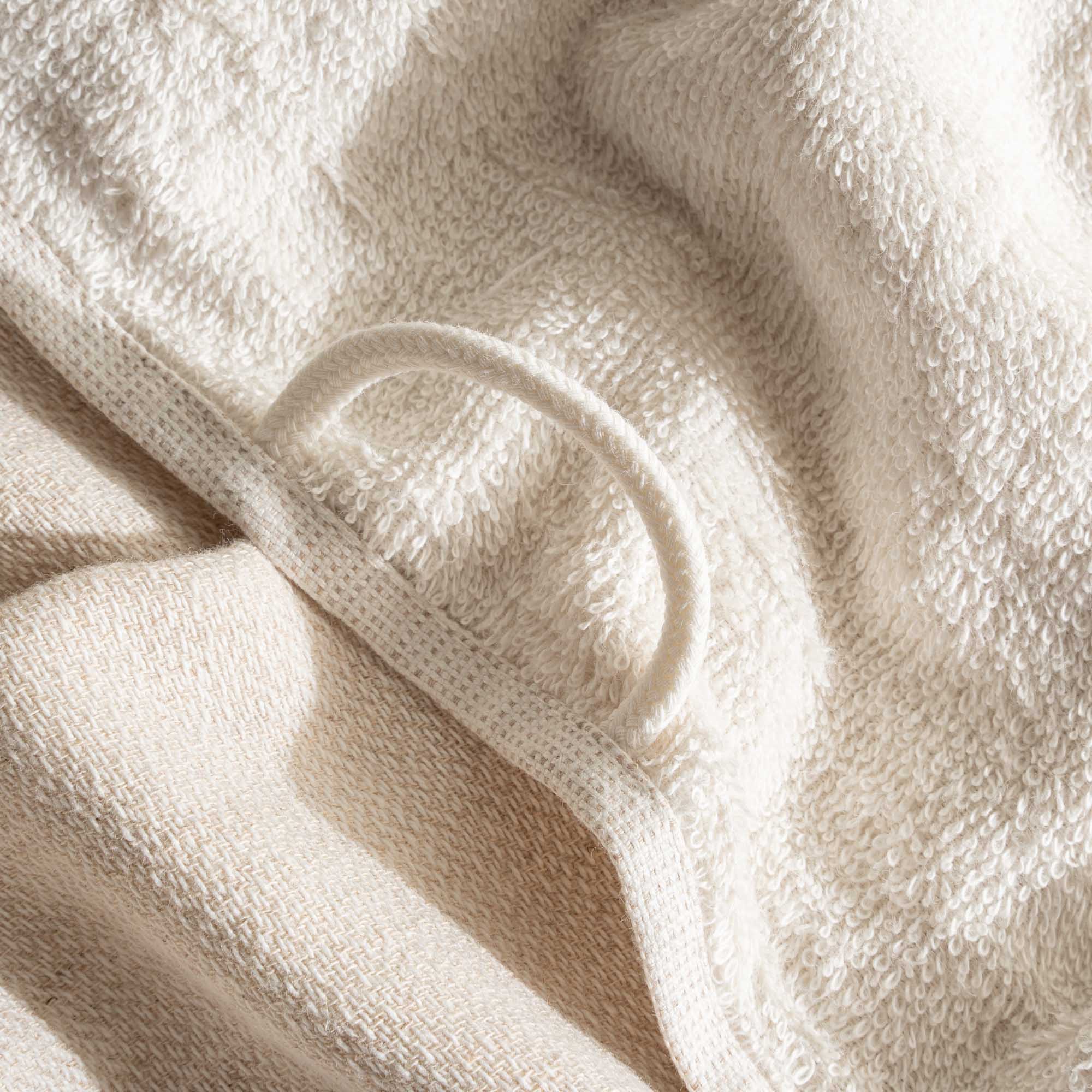 The towel hanger of Minoa's luxurious, eco-friendly three-pieces Hasna Organic Aegean Cotton and Linen Bath Set