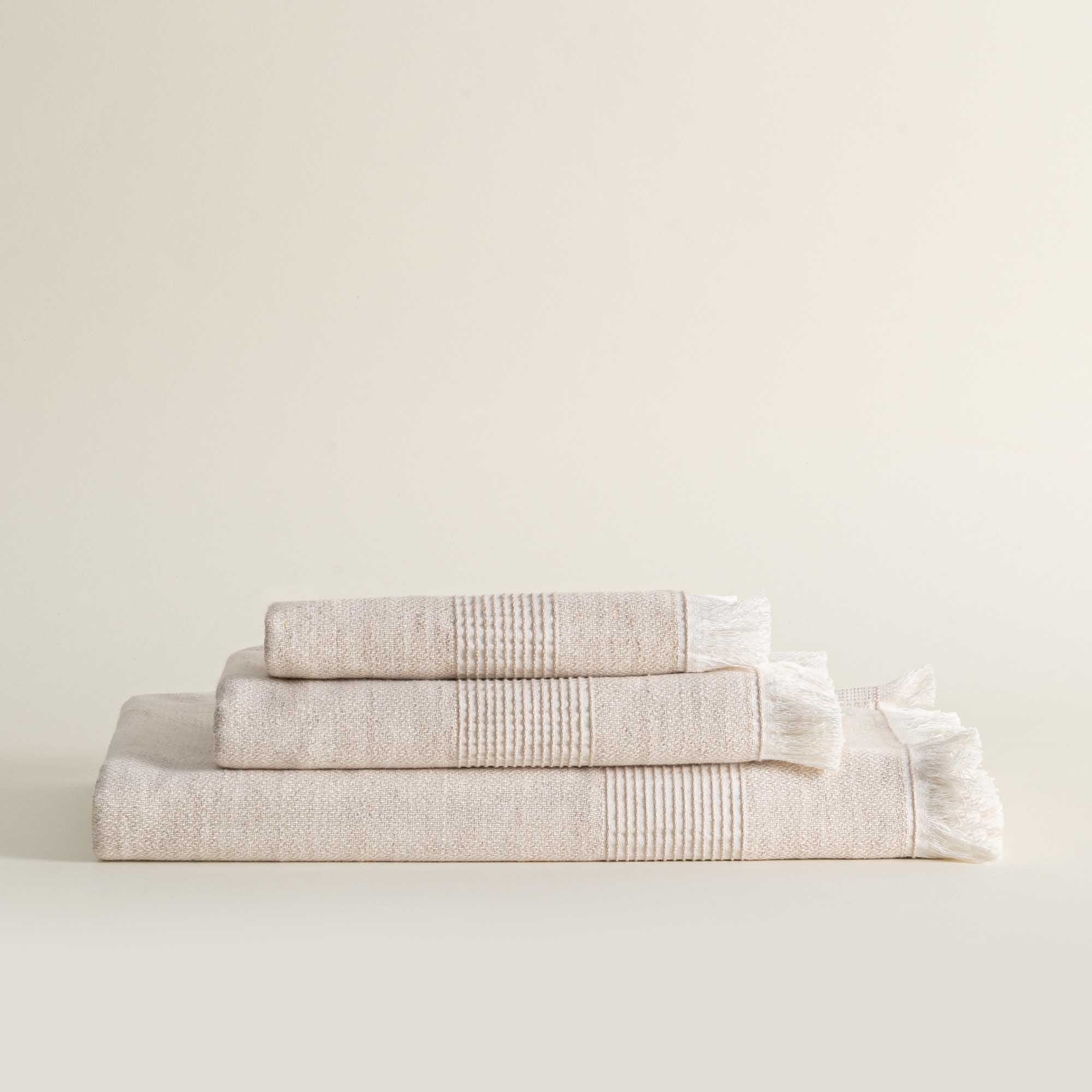 Front view of Minoa Hasna Organic Aegean Cotton and Linen Bath Set in Sandy Whisper colour, highlighting its luxurious blend of organic cotton and linen, designed for sustainable luxury