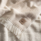 Close-up of Minoa Hasna Organic Aegean Cotton and Linen Bath Set in Sandy Whisper, showcasing its luxurious blend of organic cotton and linen for a sustainable, premium feel.