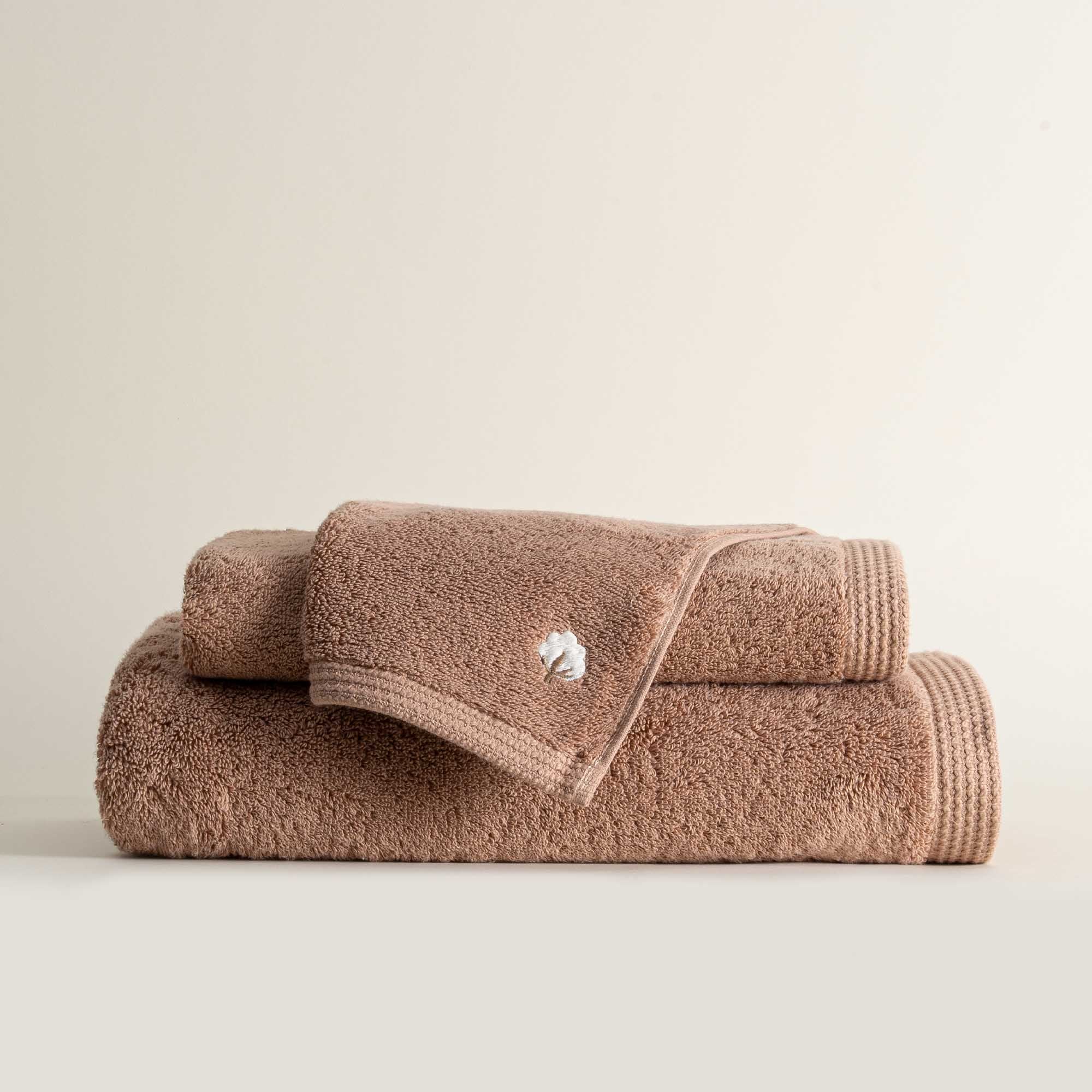 Jasper 600-gram organic Aegean cotton luxury bath, hand, and washcloth towels in Amber Amour, showcasing soft plush texture, rich tone, and luxurious fabric