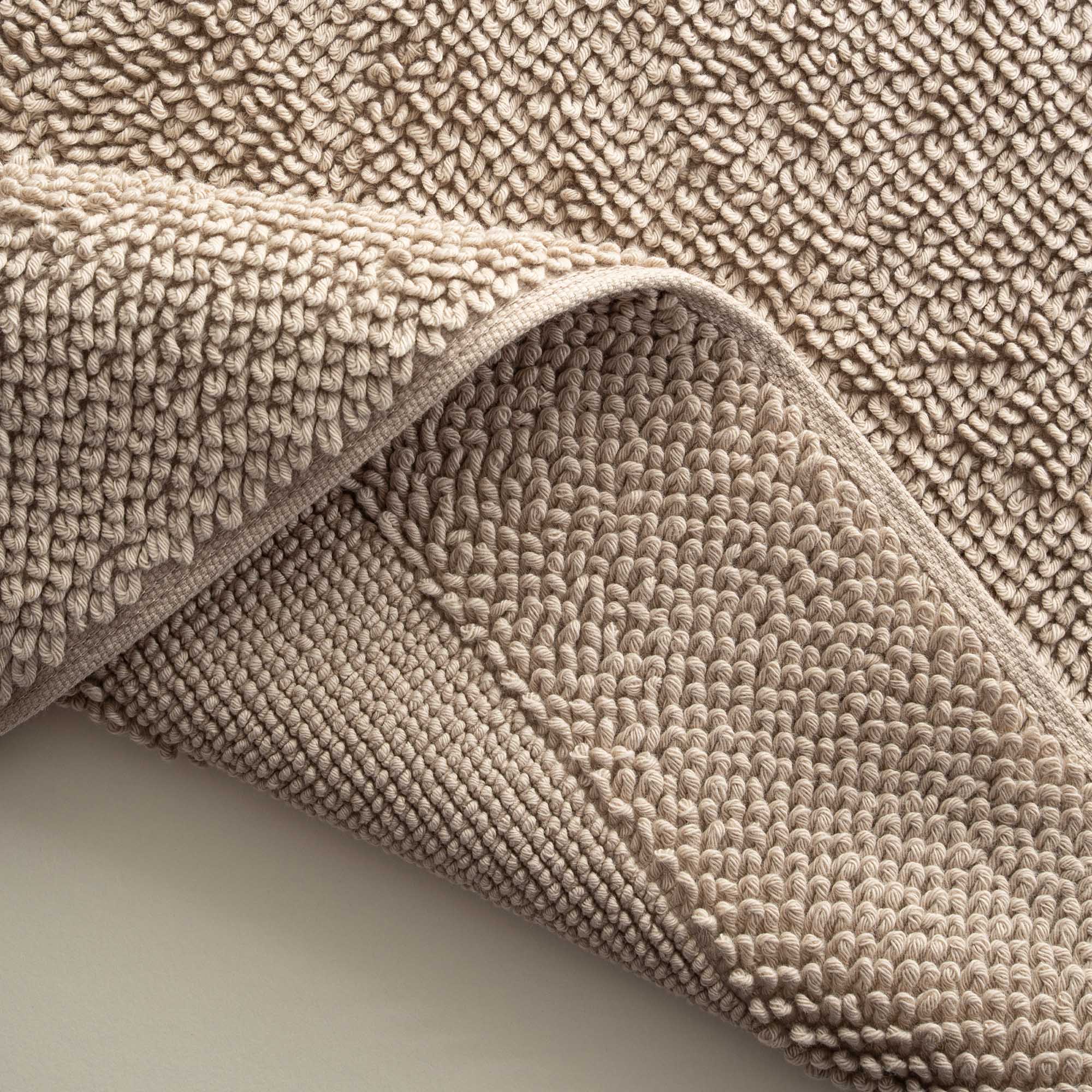 Close-up of the Kaia Aegean Cotton Bath Mat in Whispering Sands, highlighting its plush texture, subtle warmth, and high-quality craftsmanship