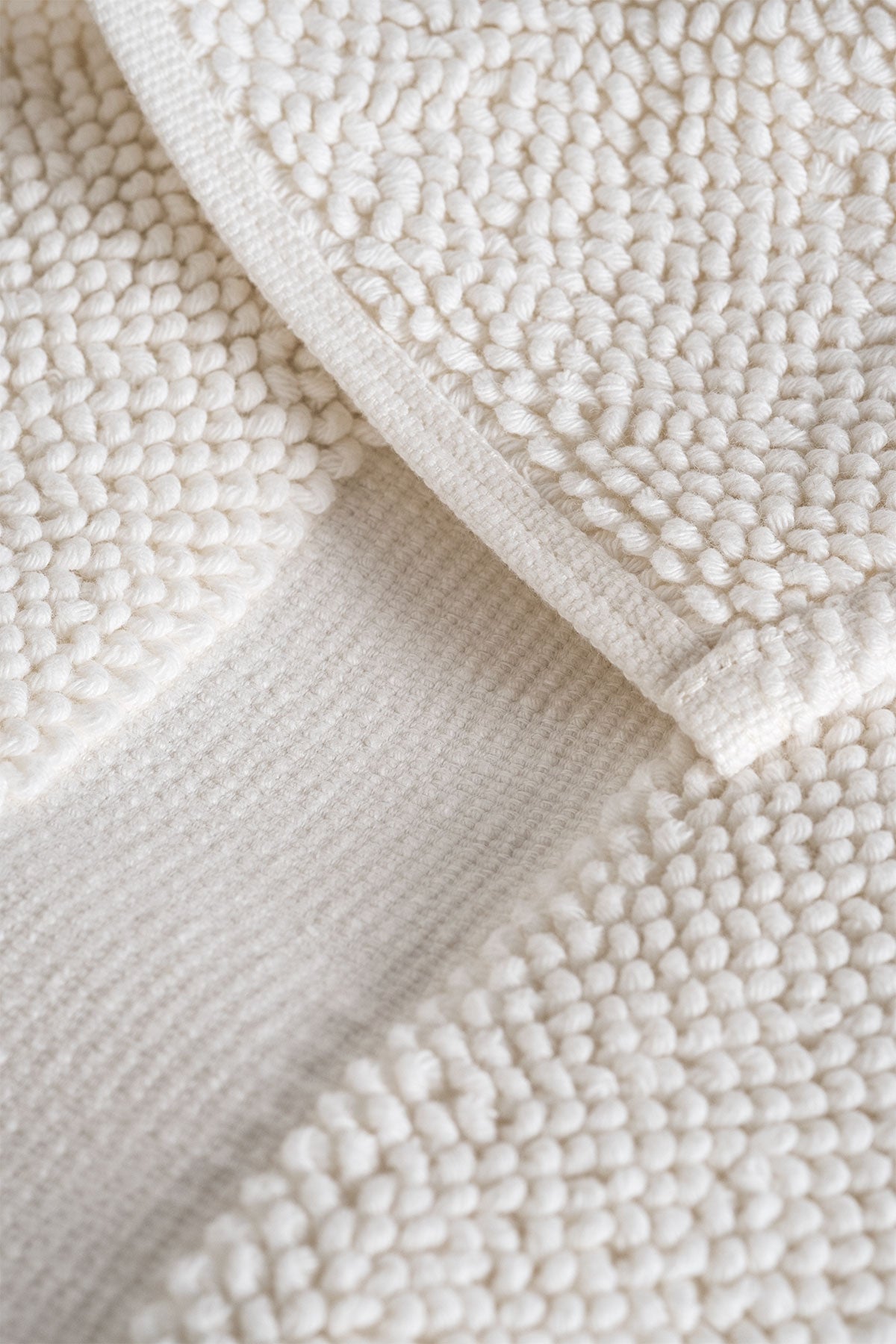 Close-up of the Kaia Aegean Cotton Bath Mat in Pearl Petal, showing its soft texture, elegant colour, and luxurious fabric