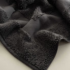 Close-up of the Kaia Aegean Cotton Bath Mat in Charcoal Charm, showcasing its rich colour, plush texture, and refined craftsmanship