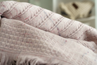 Close-up of Maia Pink Powder organic bath towels set, including bath, hand, and washcloth, showcasing luxurious texture and premium organic cotton quality