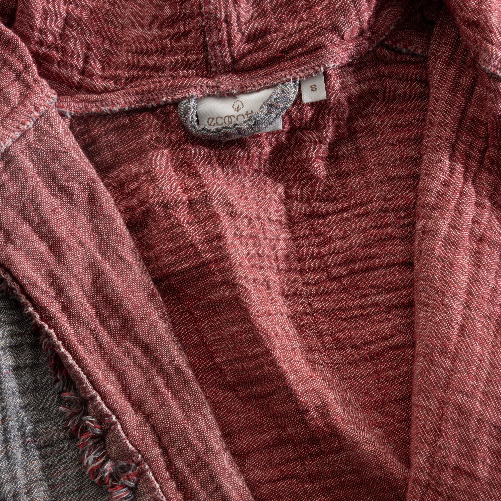 Close-up of the back of the Women's Muna Organic Aegean Cotton Gauze Two-Sided Robe in Bordeaux Bliss, highlighting the Ecocotton tag and the robe's refined design and quality