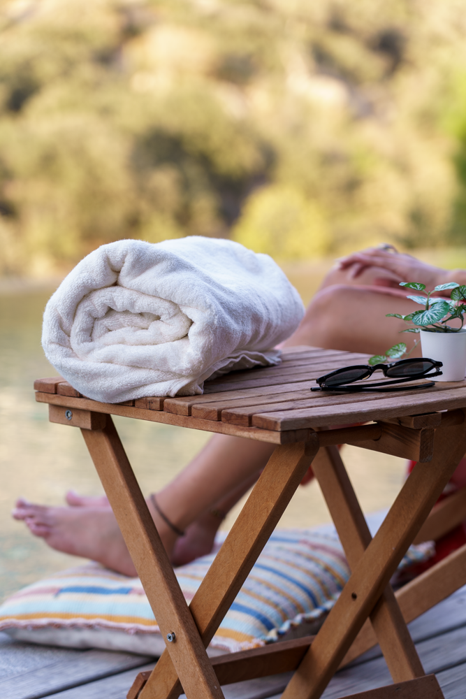 Plush Lite 500-gram Aegean Cotton guest bath towel pack of four in Moonlight Pearl by Minoa USA Canada, rolled up to showcase soft texture, elegant color, and premium organic bath towels quality