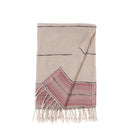 Beige and red plaid towel with fringes on a white background