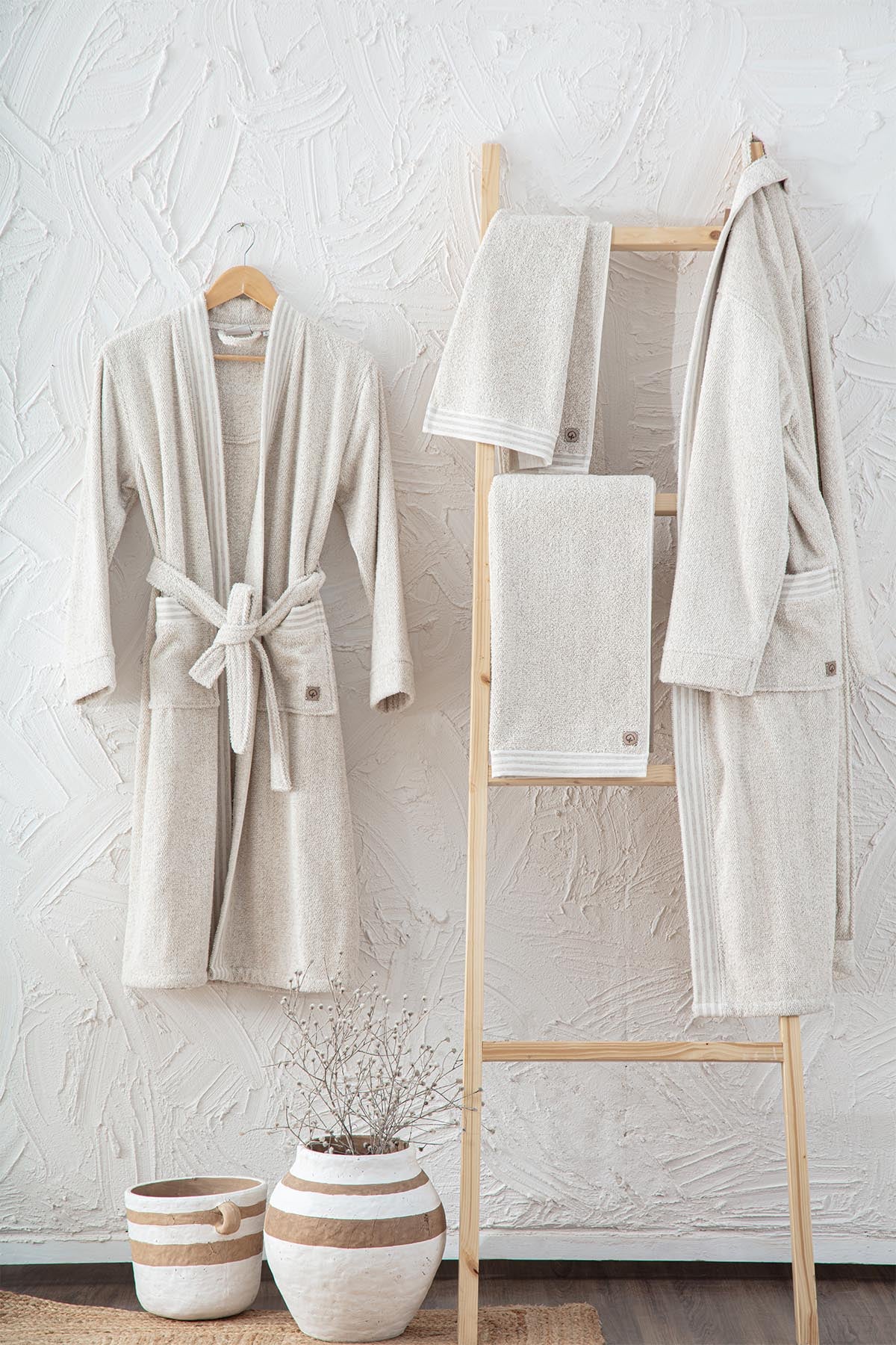 Minoa's organic, luxury bath robe -Raisa Hemp & Organic Cotton Mens Robe hanging on the wall
