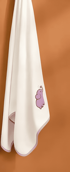 White towel with a purple elephant character on a brown background