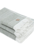 Gray and white towel with a brand logo on a white background