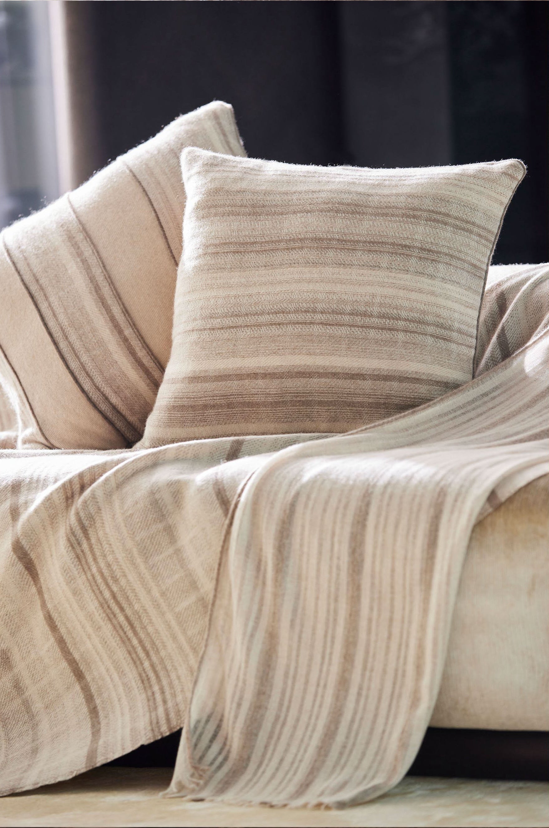 Luxury brownish lines pattern cushions placed on sofa