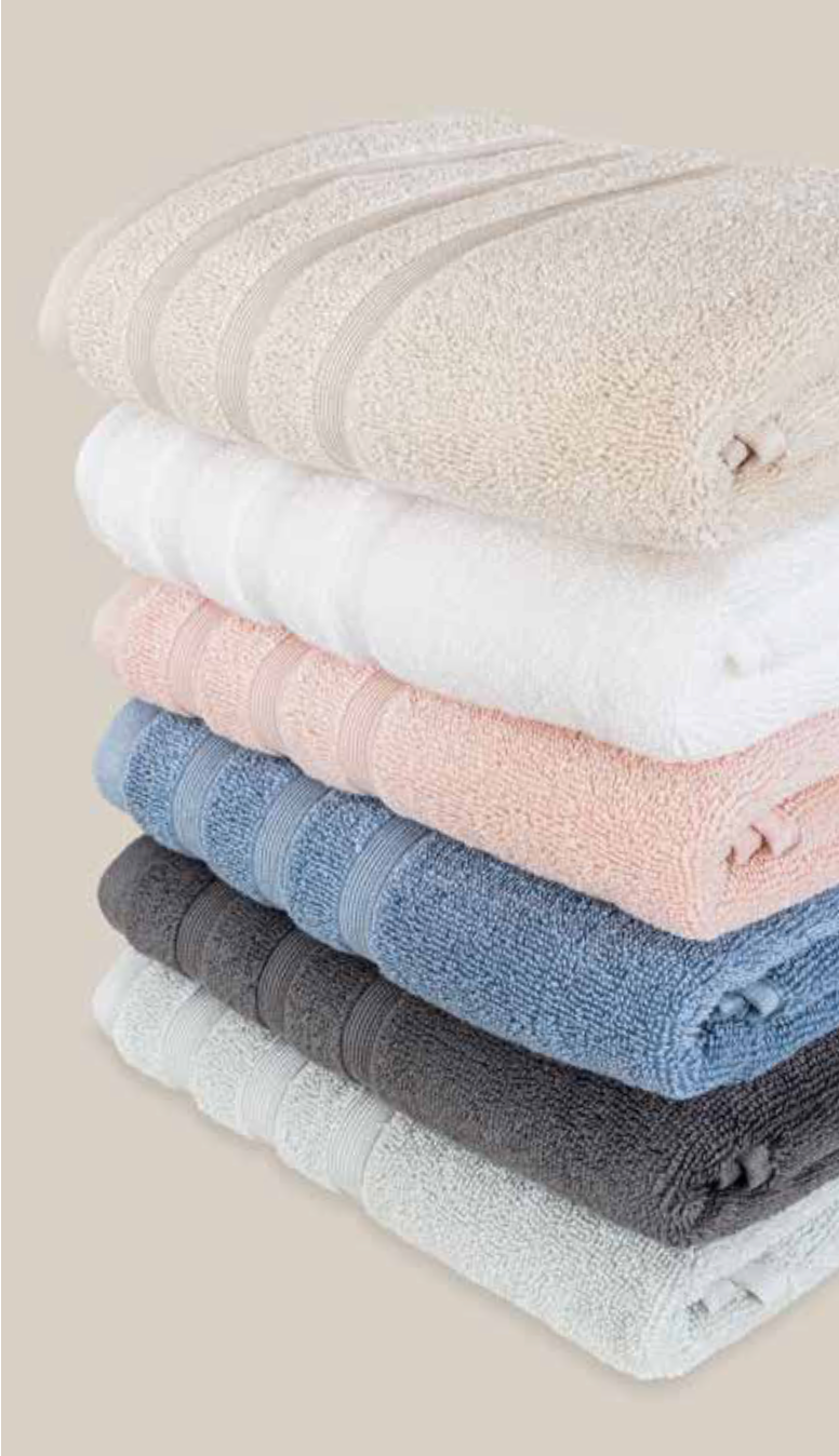 Set of Velora 550-GSM Cotton Towels in beige, mint, anthracite, blue, pink, and white, an organic cotton towel showcasing soft cotton fabric, ideal for absorbency and comfort after bath or shower