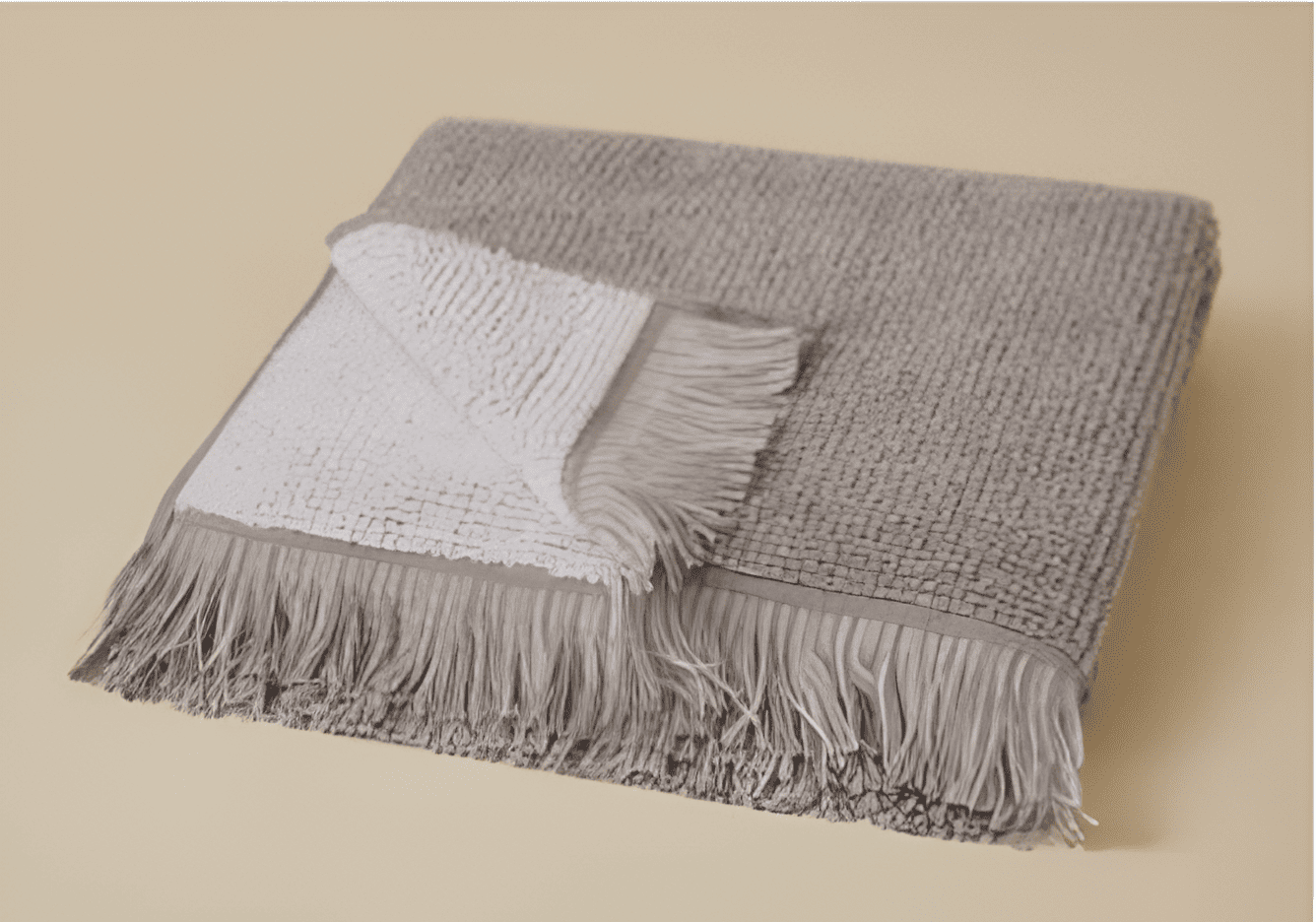 Plush 650-GSM Cotton Terry Towel in grey, an organic cotton towel with eyelash fringe, offering a soft, absorbent feel and stylish look.