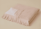 Plush 650-GSM Cotton Terry Towel in pink, an organic cotton towel featuring eyelash fringe, showcasing its soft texture and luxurious design.