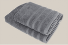 Velora 550-GSM Cotton Towel in anthracite, an organic cotton towel combining a deep grey tone with a soft, absorbent cotton texture.