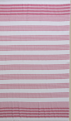 Fuchsia/White Nesta beach towel made with 100% organic cotton, with a luxuriously soft texture and carefully fabricated comfort