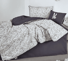 Bedding set with gray and white pattern on a bed