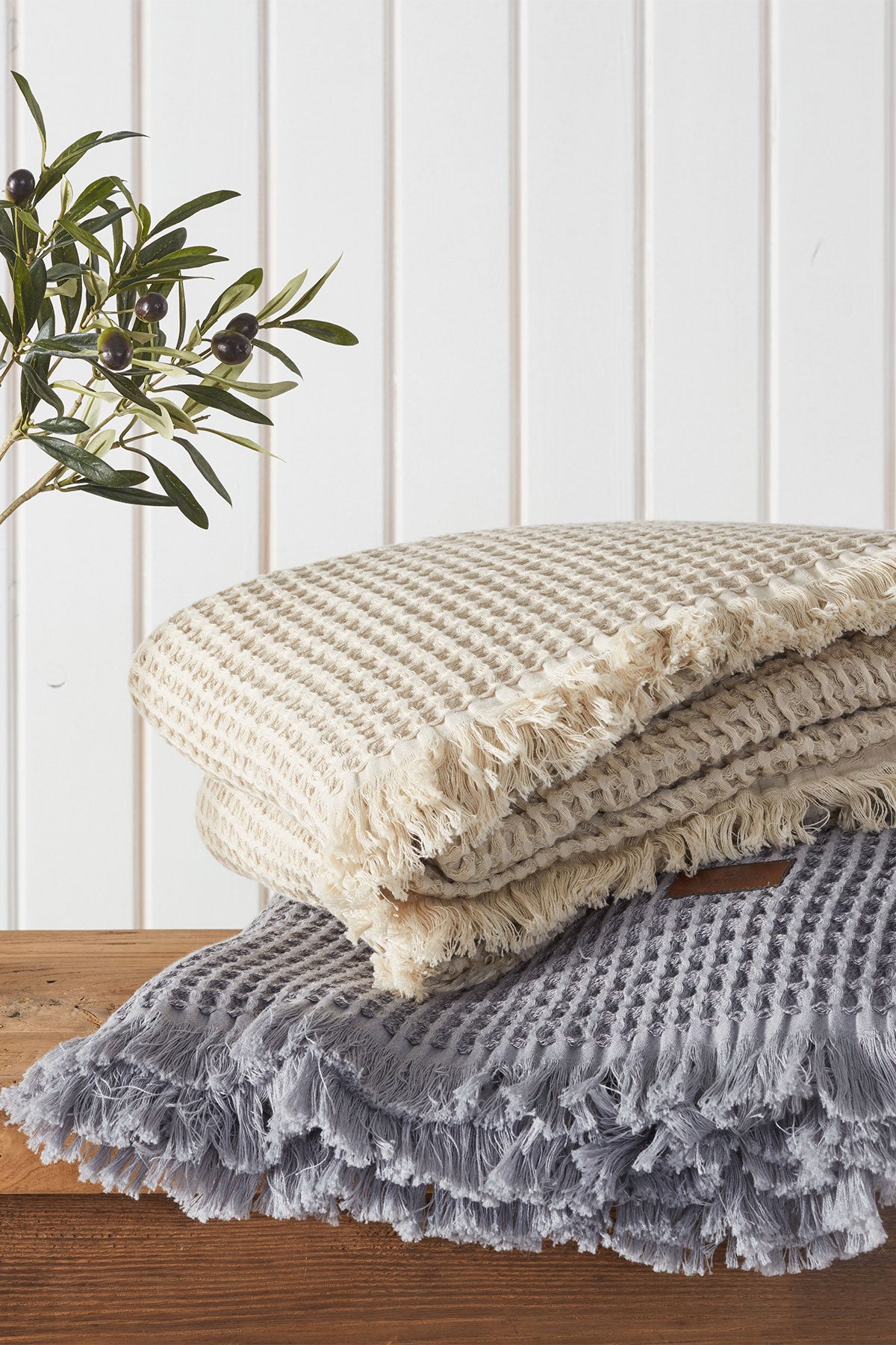 Two Organic Aegean Seren Waffle Large Throw/Bed Spreads 400-gram in Silver Suede and Beige, highlighting their luxurious texture and eco-friendly organic cotton design