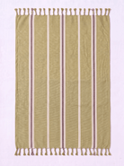 A rectangular woven towel with fringe on both short ends, shown flat against a pale pink background. The fabric is predominantly olive green with vertical stripes in cream, white, and muted mauve-brown.