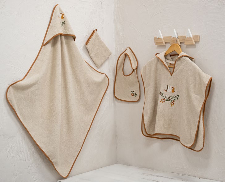 Beige baby Poncho set with embroidered designs on a white background