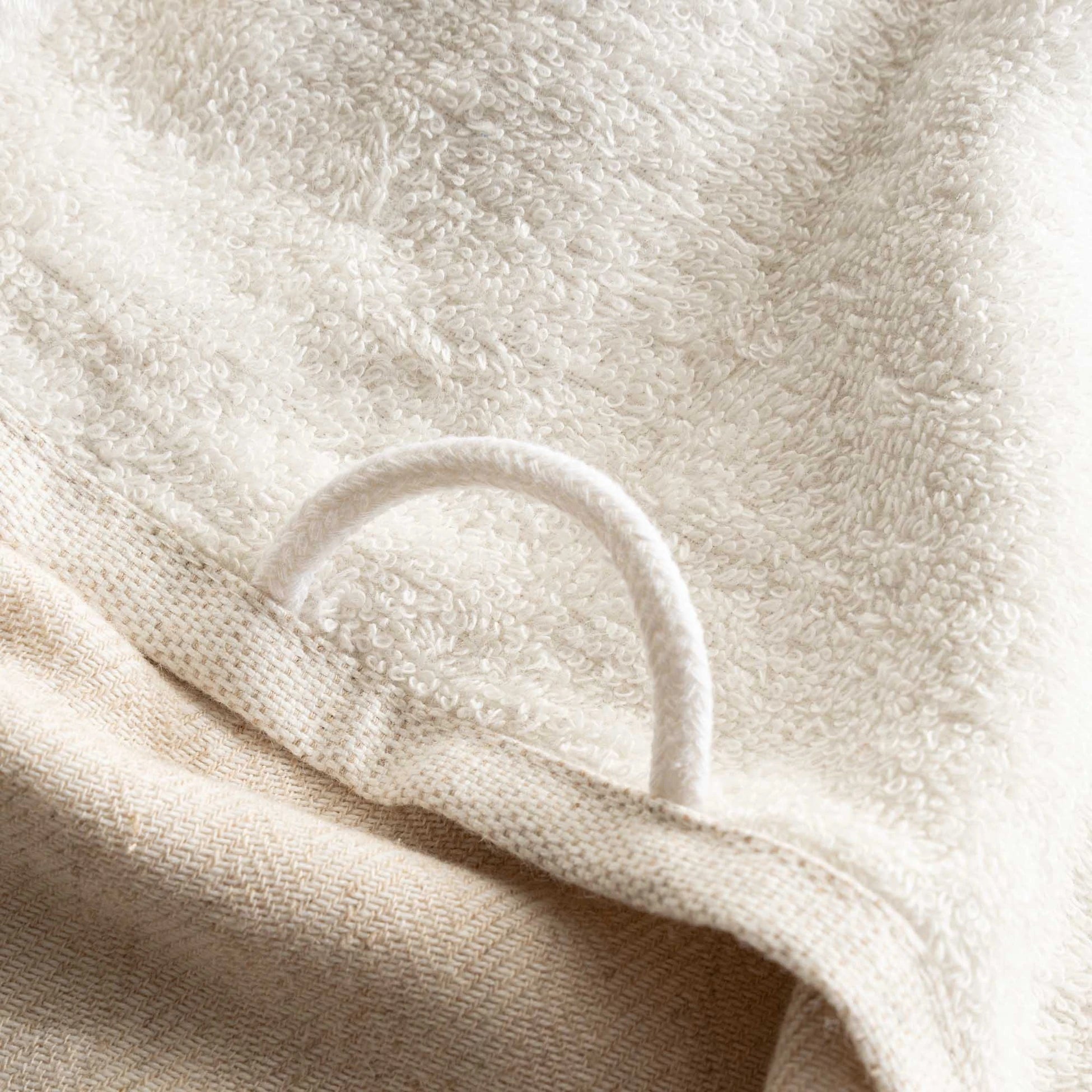 The towel hanger of Minoa's luxurious, eco-friendly three-pieces Erva Organic Aegean Cotton Bath Set