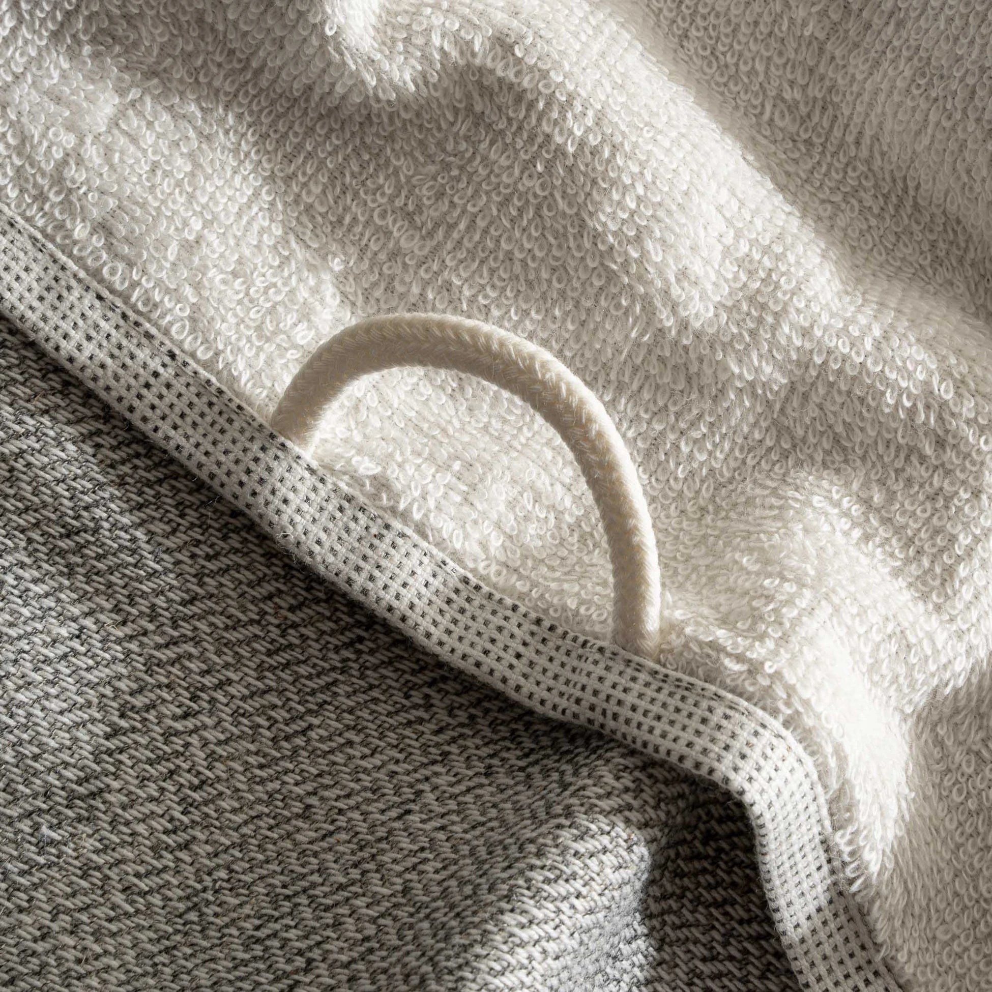 The towel hanger of Minoa's luxurious, eco-friendly three-pieces Hasna Organic Aegean Cotton and Linen Bath Set in Grey Haze