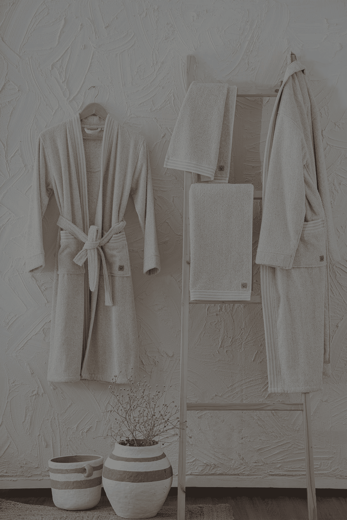 Minoa's organic, luxury bath robe -Raisa Hemp & Organic Cotton Mens Robe hanging on the wall