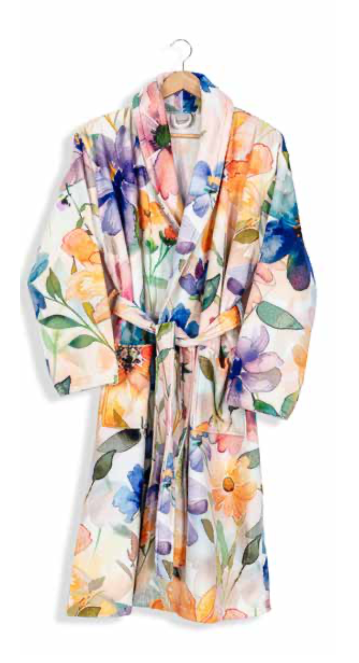 Colorful floral print bathrobe with belt tie on hanger — bold and artistic eco-luxury home textile design.