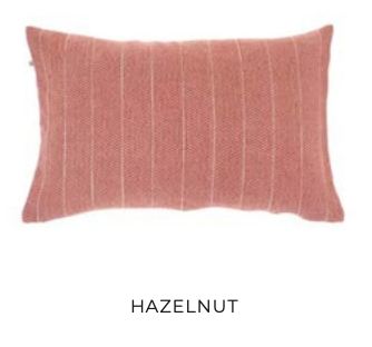 Hazelnut-colored rectangular pillow with vertical white stripes — eco-luxury decorative cushion for sustainable interiors.