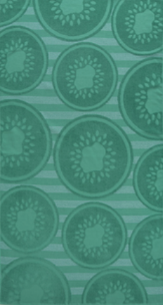 Fresh green jacquard beach towel with kiwi fruit slice pattern and striped background from Minoa Home.