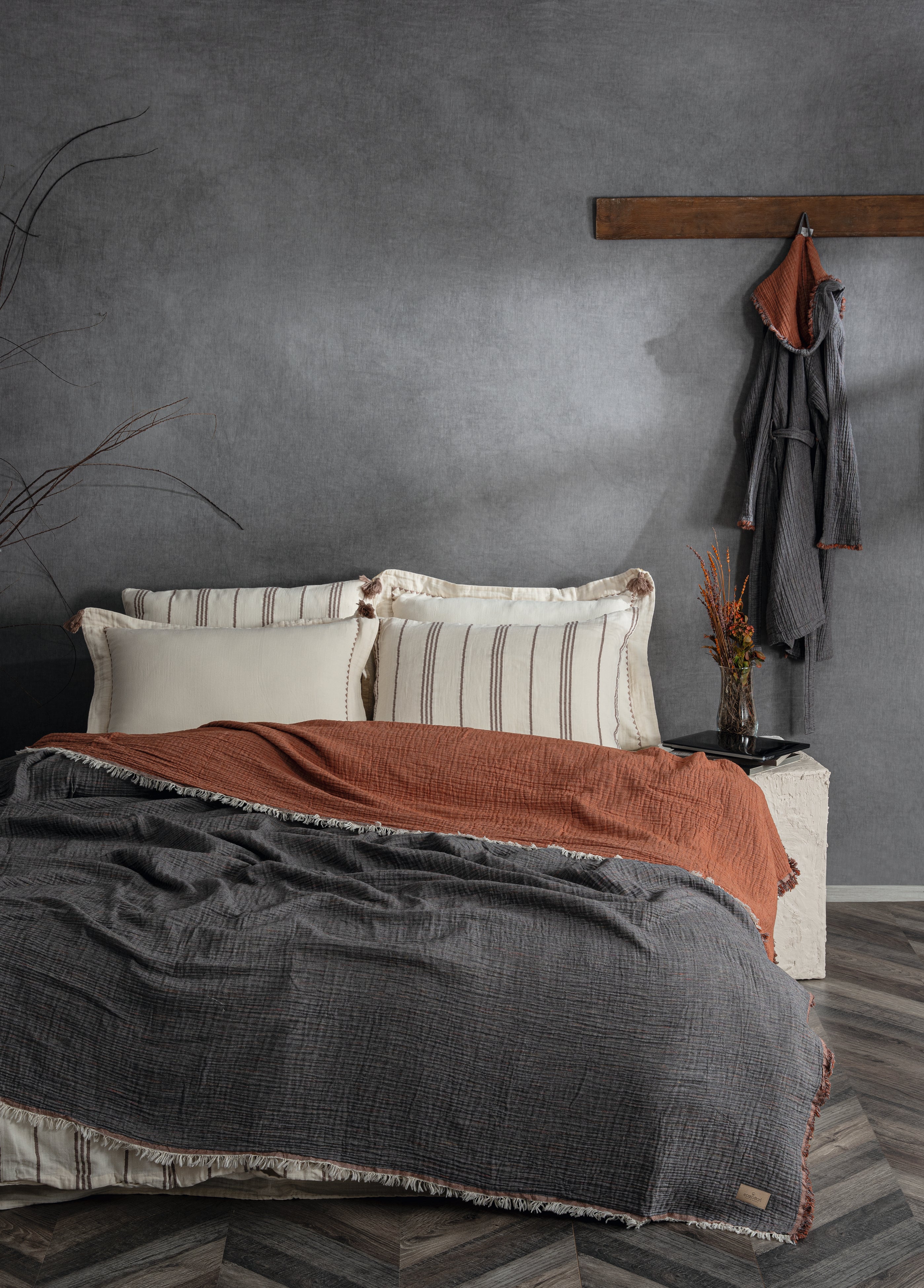 Reversible Muna organic gauze bed spread in Terra, soft earthy throw crafted for sustainability with organic cotton sheets.