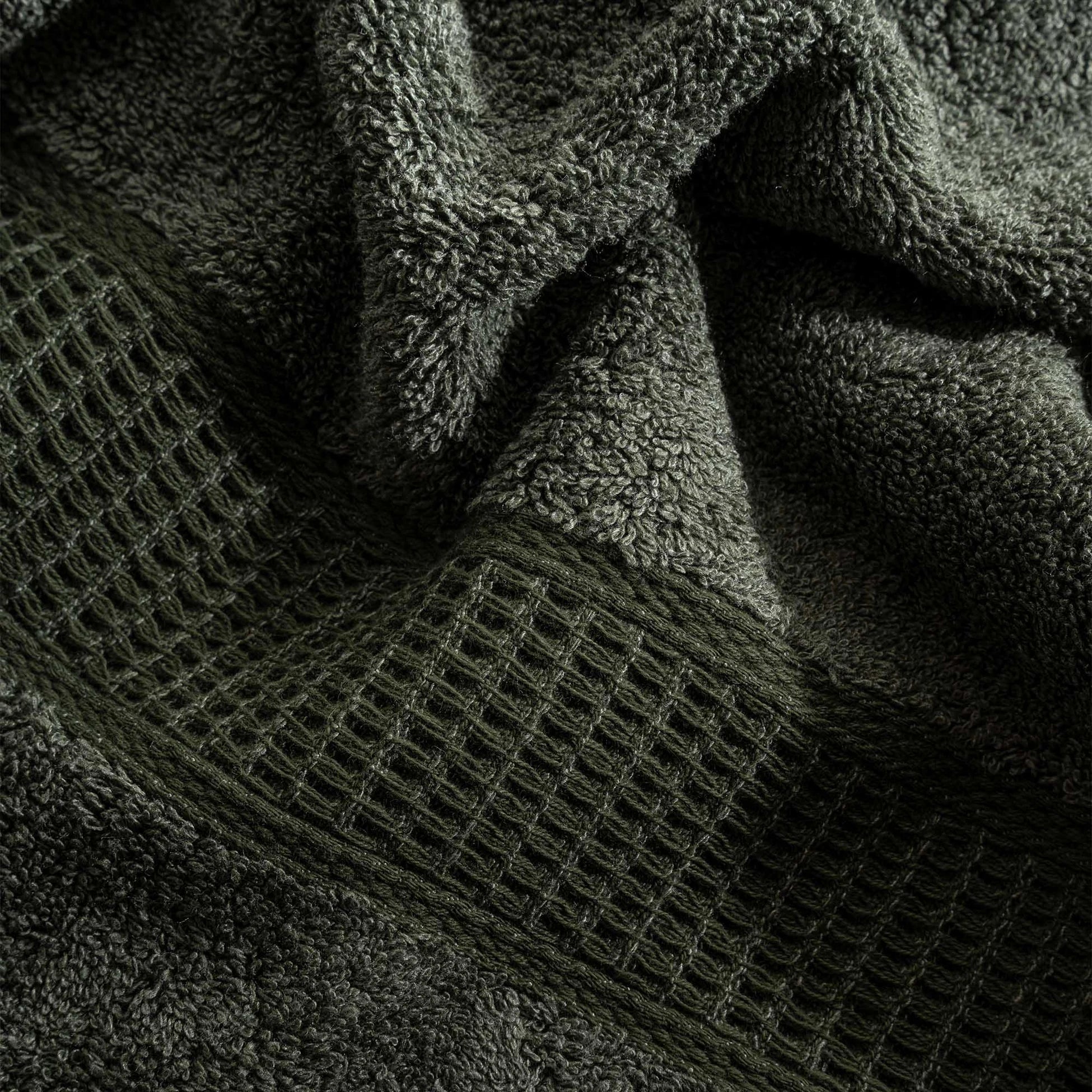 Close-up of Naia & Cotton luxury bath towel in Mossy Muse by Minoa USA Canada, showcasing soft texture, rich color, and premium quality fabric